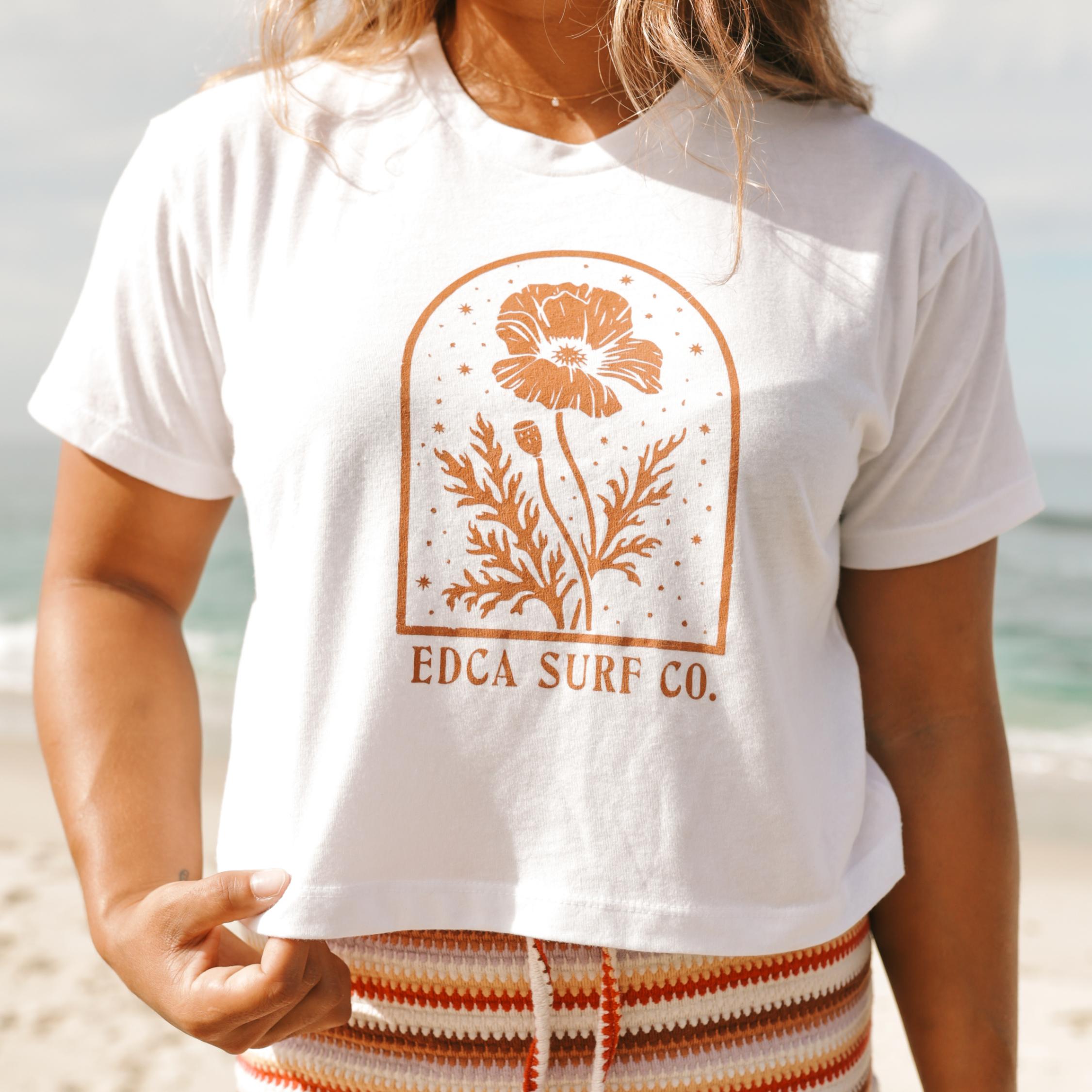 Female model wearing white cropped Everyday California t-shirt