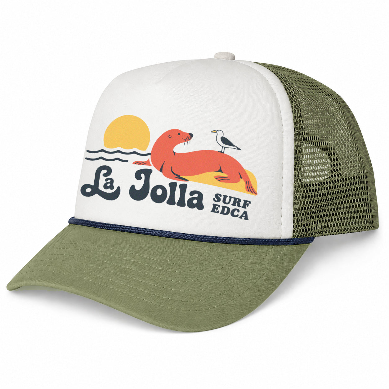 A trucker-style baseball cap with an off-white front panel, olive green brim and mesh back, and a colorful 'La Jolla Surf Edca' graphic featuring a seal, bird, and sun.