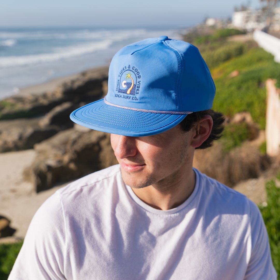 Light blue Crushable Snapback Hat at the beach from Everyday California 