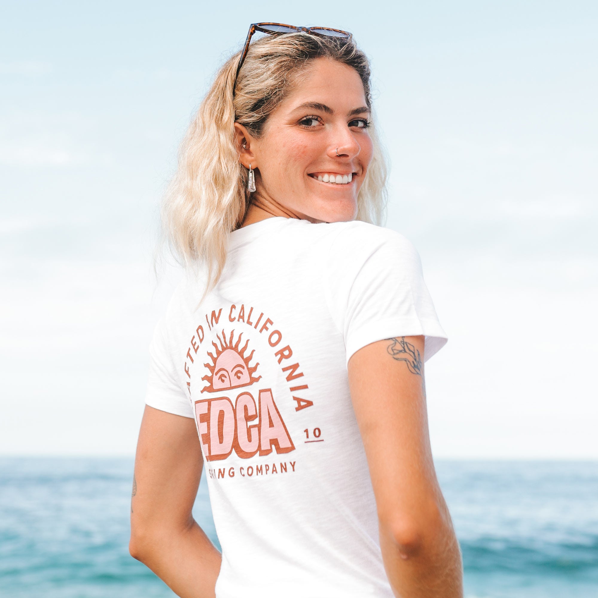 Girl at the beach wearing everyday california San Pedro Tee white back view