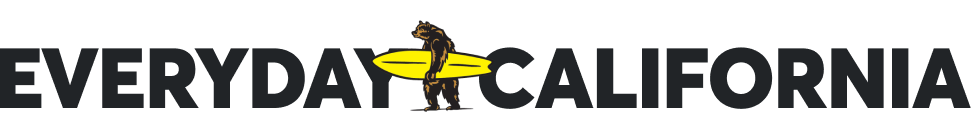 Everyday California logo featuring a bear holding a yellow surfboard, positioned in between the words "EVERYDAY" and "CALIFORNIA".