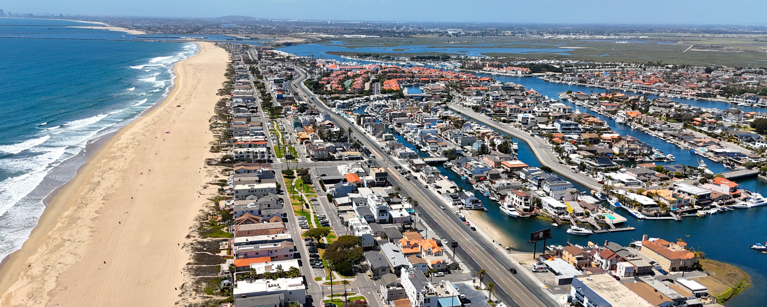 Aerial image of Huntington Beach in California. You can see the Huntington Harbour canals separated from Huntington Beach by the Pacific Coast Highway.