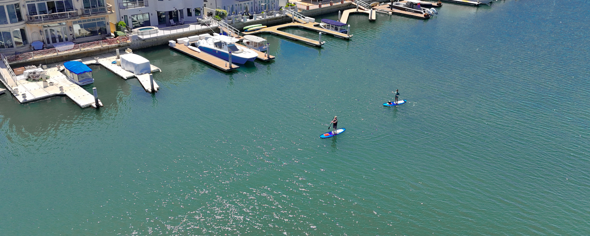 Aerial drone shot of stand up paddle boarders in Huntington Harbour