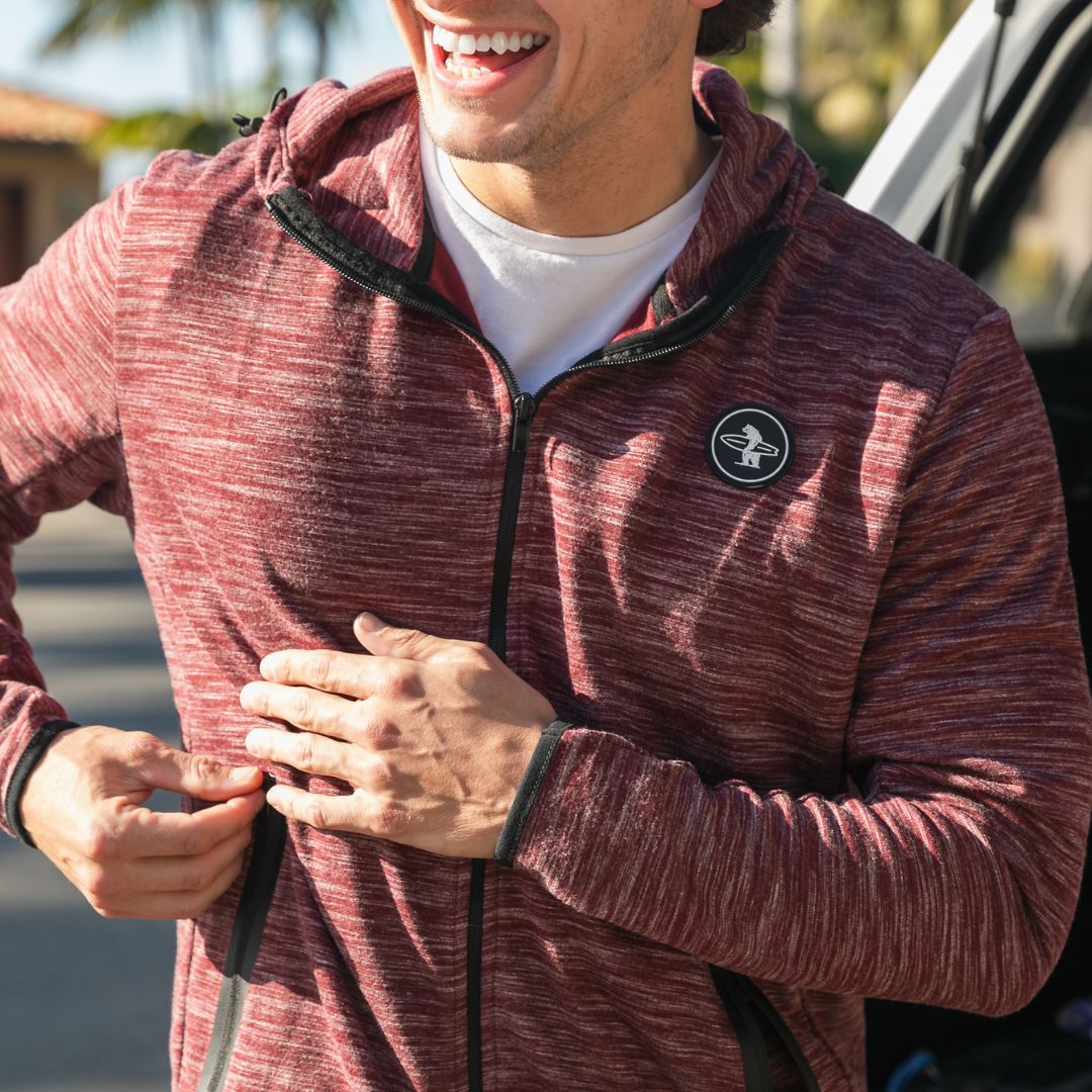 Man laughing while adjusting his zippered pocket Palisade hoodie in Maroon from Everyday California 