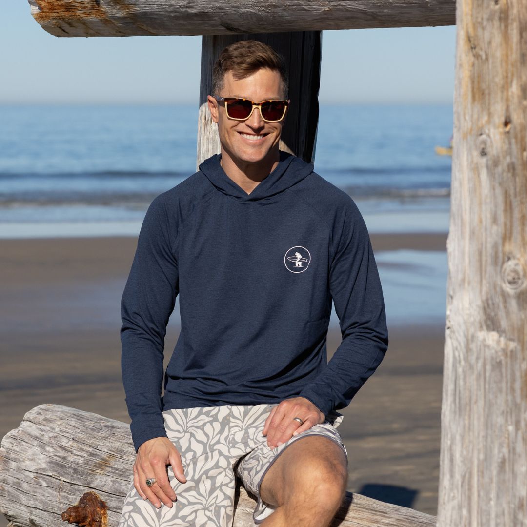 Man on La Jolla Shores wearing Everyday California Breakers SPF Hoodie