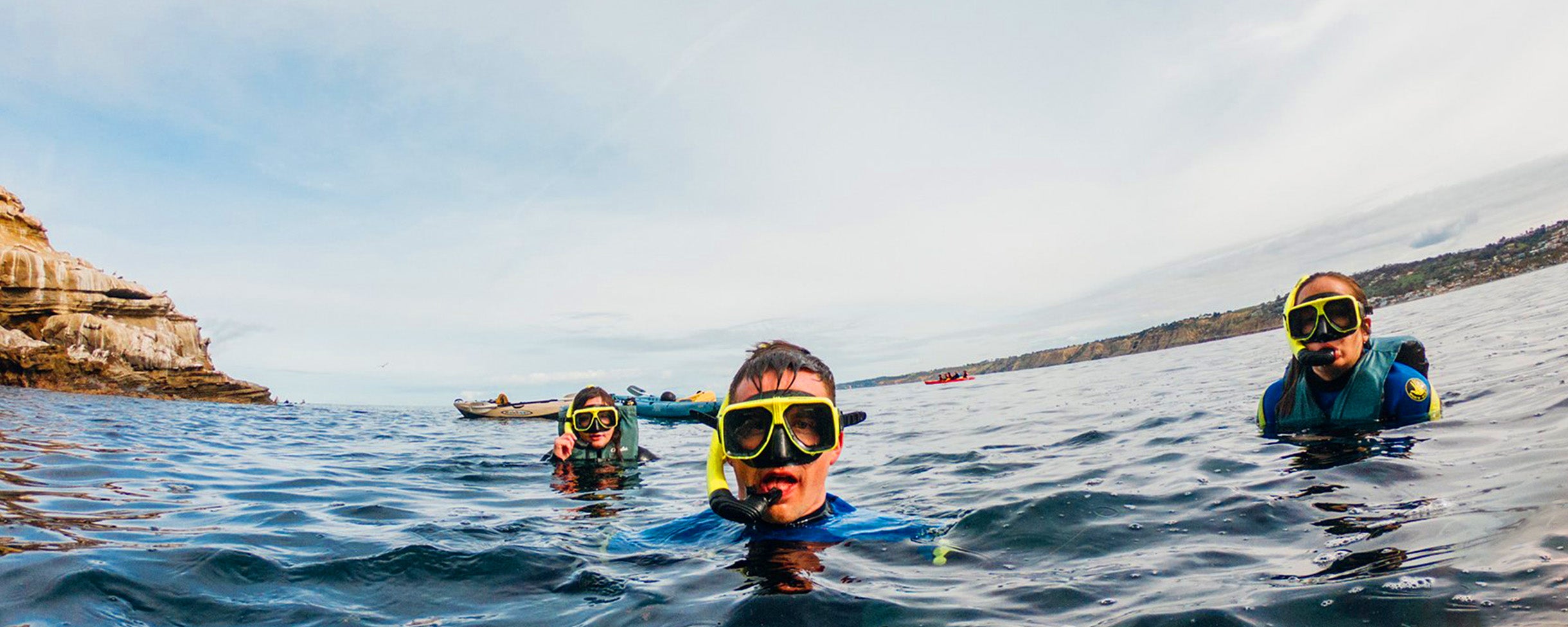 Three snorkelers in the La Jolla Ecological Reserve with a snorkel rental with Everyday California