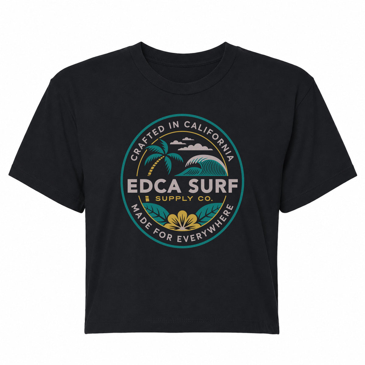 A black short-sleeve crewneck t-shirt featuring a circular graphic on the chest. The graphic displays a tropical beach scene with palm trees, waves, and a yellow flower, surrounded by the text 'CRAFTED IN CALIFORNIA', 'EDCA SURF SUPPLY CO', and 'MADE FOR EVERYWHERE'.