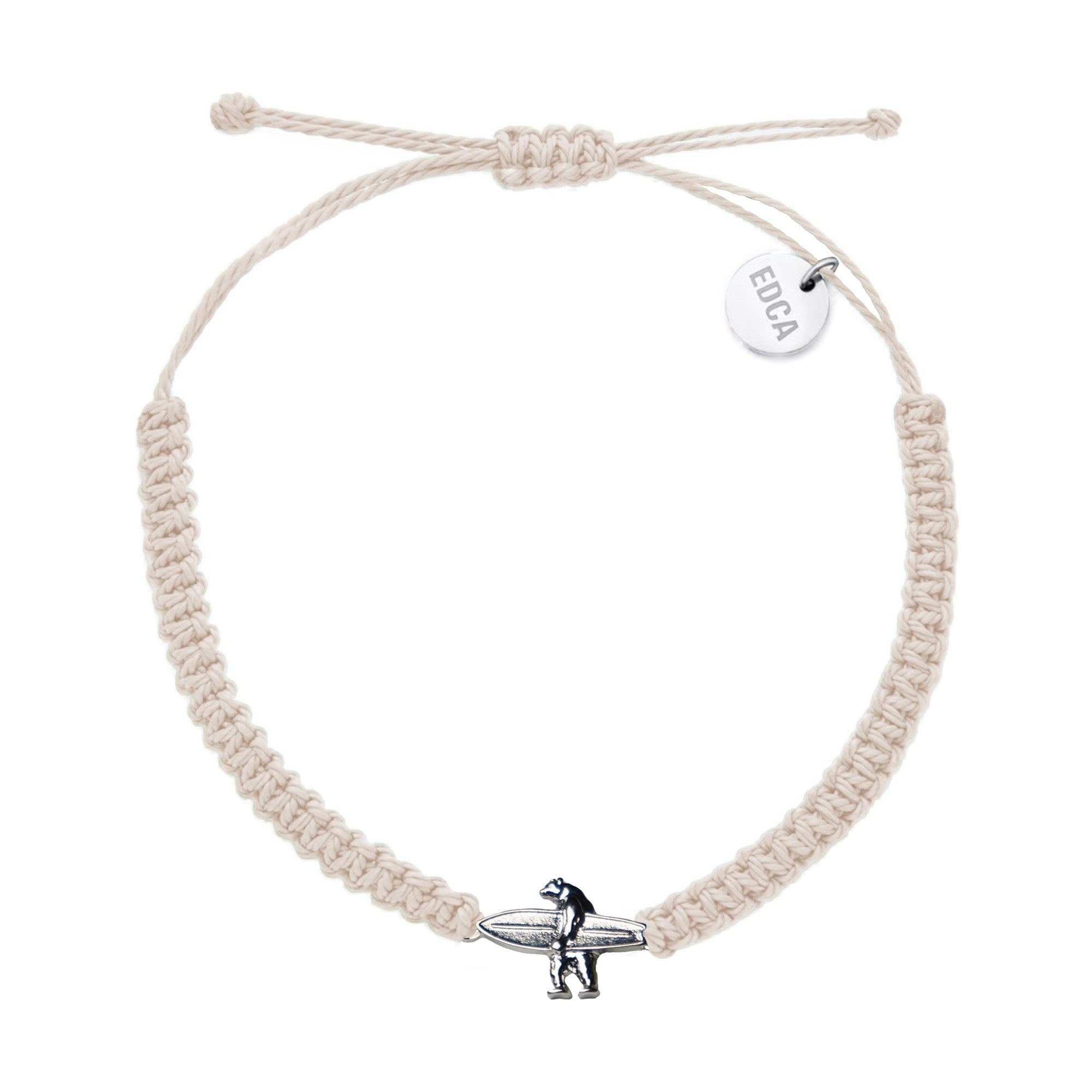 A cream colored woven charm bracelet with a metal bear charm and the brand tag 'EDCA'.