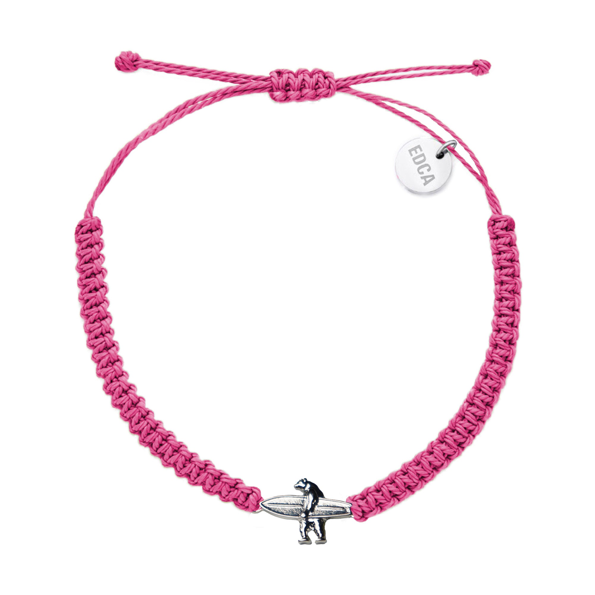 Pink woven charm bracelet featuring a metal charm of a bear holding a surfboard in the center, and a circular charm featuring the word 'EDCA' near the edge.