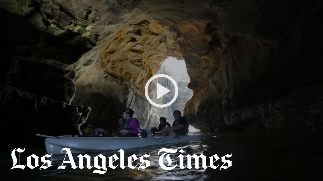 First person point of view photo from inside an ocean sea cave in La Jolla. The photographer is on a kayak