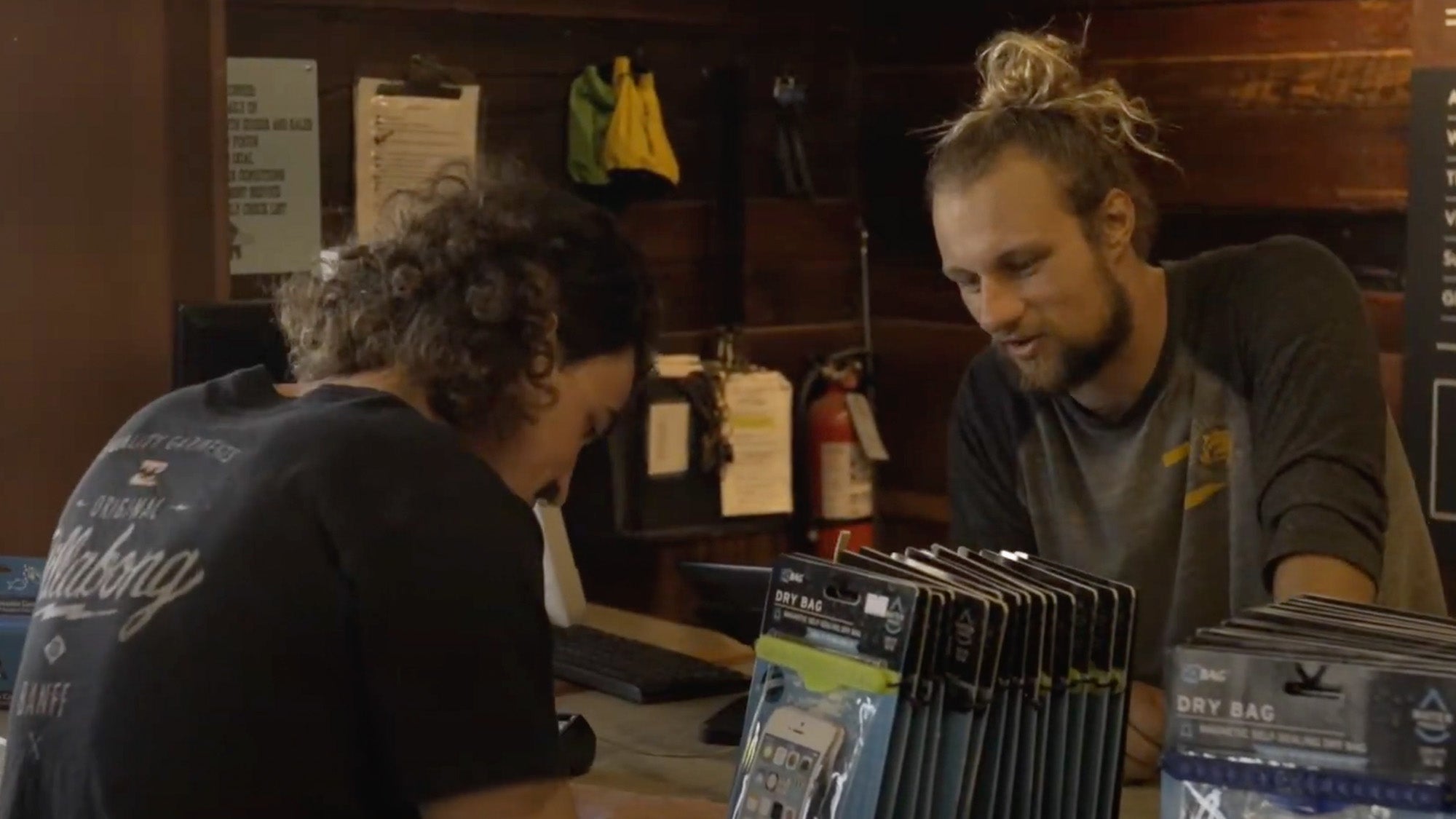 Photo of a man at a counter renting a kayak