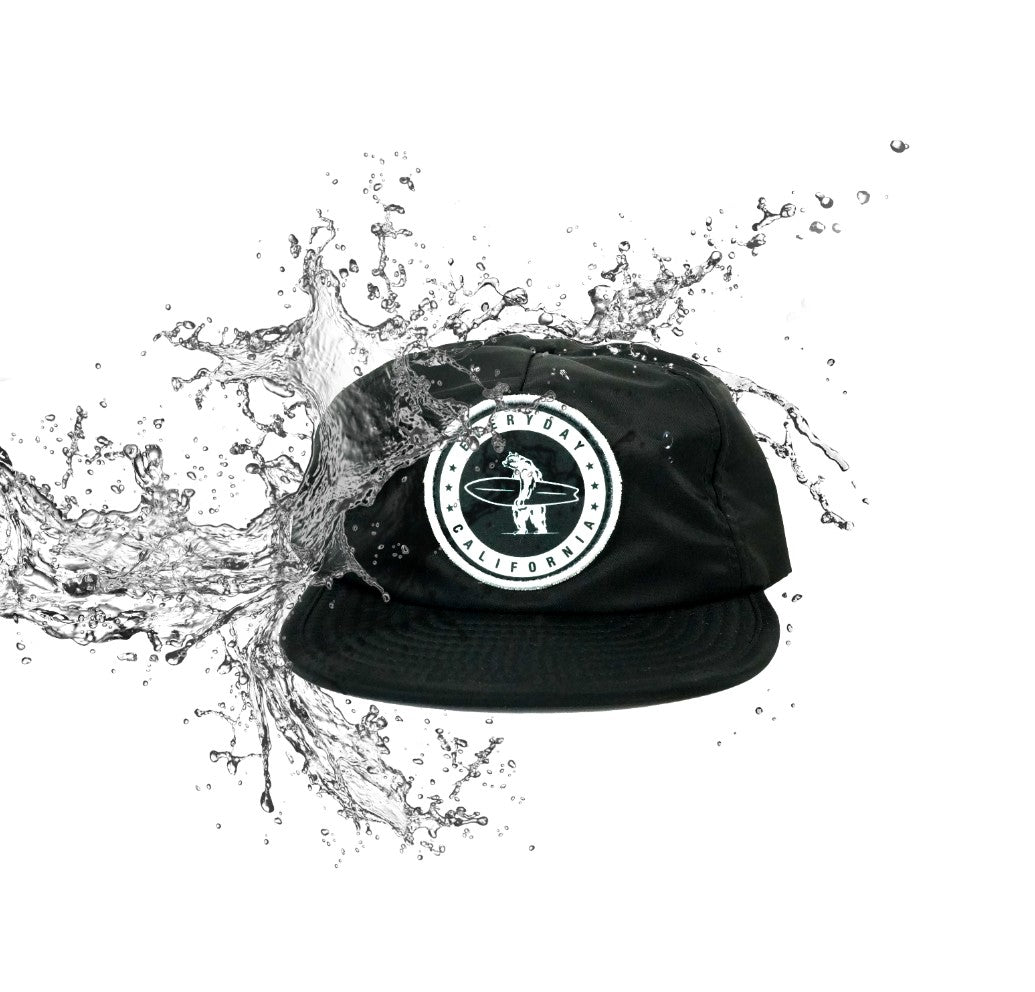 Dark green hat with "Everyday California" and bear being splashed with water