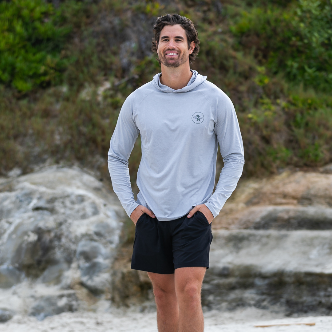 Male model wearing the Everyday California Breakers Hoodie on the beach