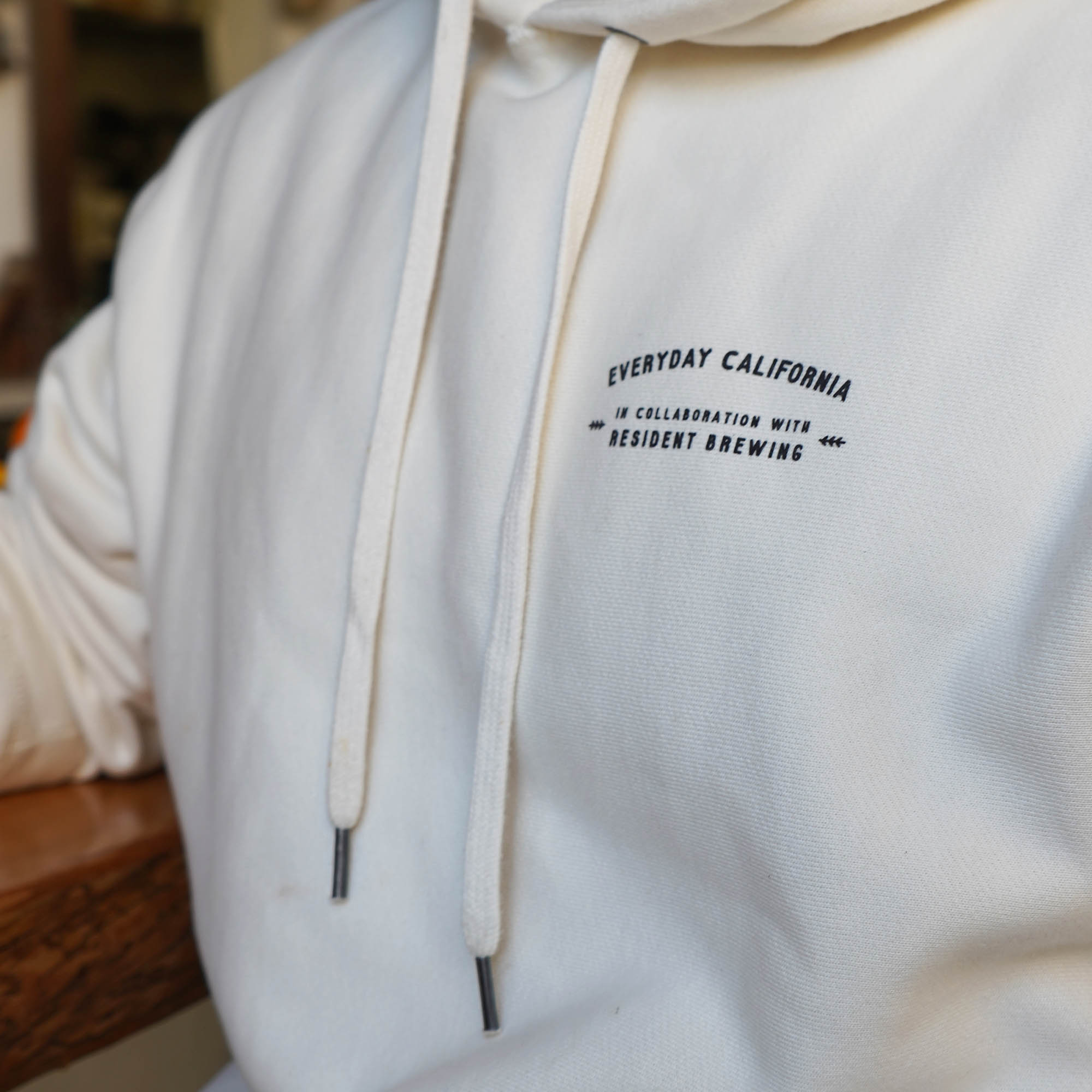 Everyday California Brewmaster Hoodie - thick cream hoodie with Brutus the Bear logo holding a beer