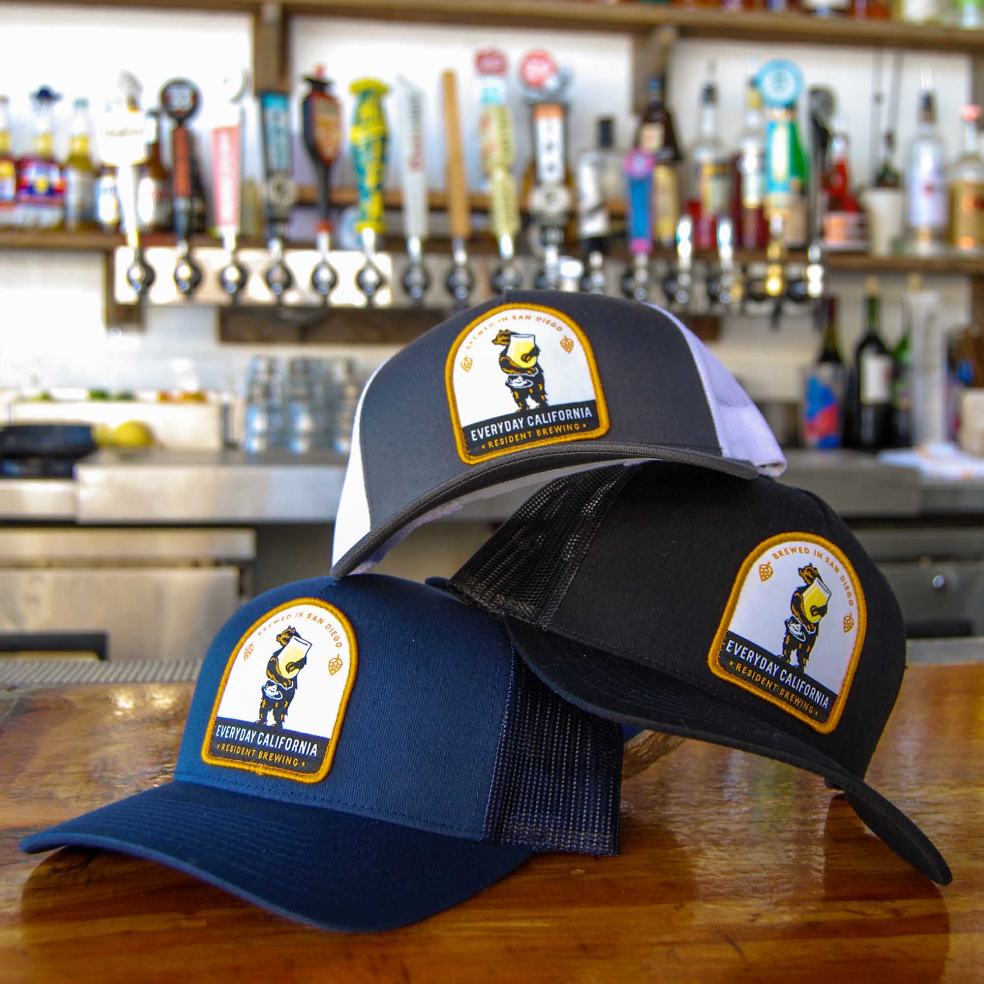 Everyday California Brewski Trucker Hats in all colors on bar