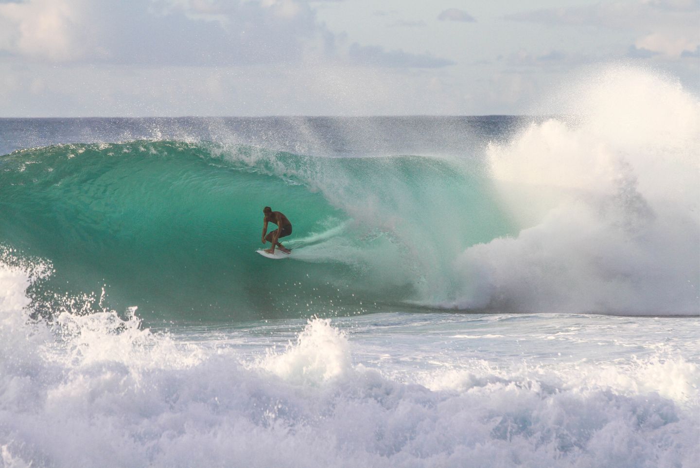 Surfer shredding waves in San Diego California 