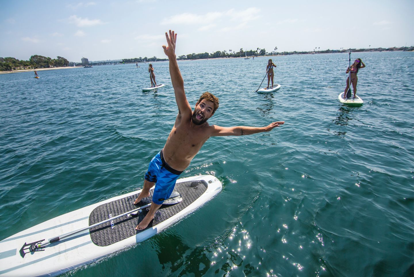 a group of paddle boarders on the Pacific Ocean on inflatable paddle boards in La Jolla San Diego