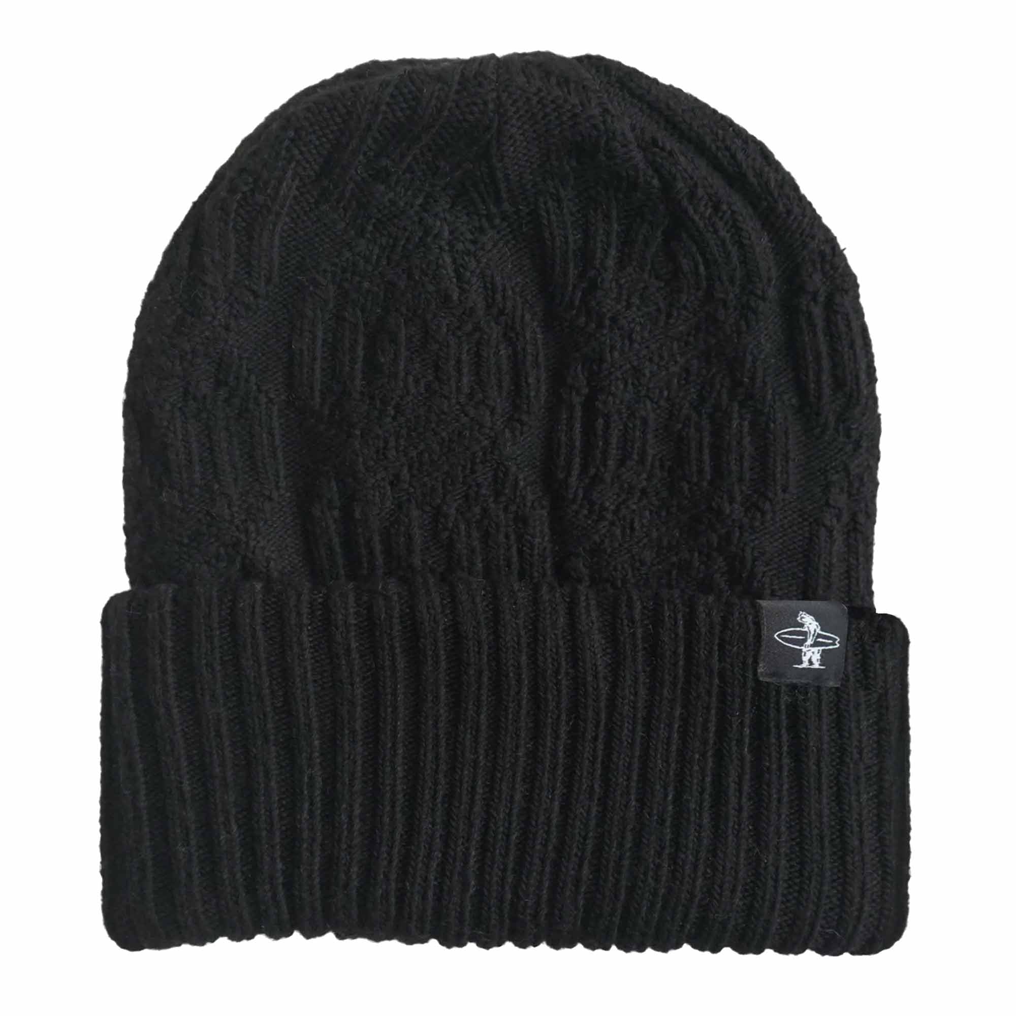 Heavyweight black cable knit beanie with a black clip tag on the righthand side of the beanie cuff that features a white woven image of a bear holding a surfboard. 