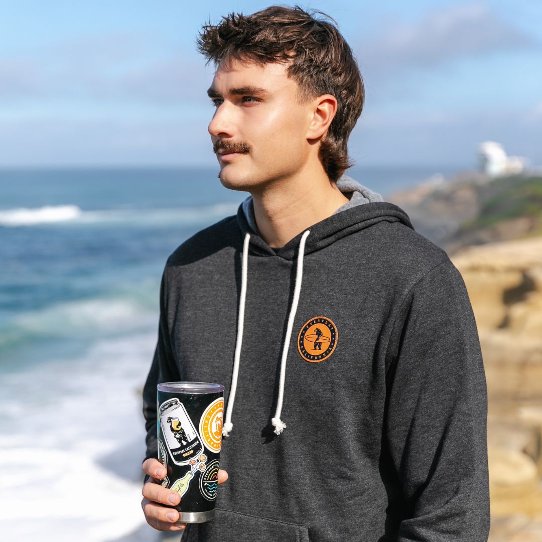 The Challenger Hoodie in Charcoal from everyday California. It is the soft, not too thick, but still keeps you warm on a breezy Beachy day.