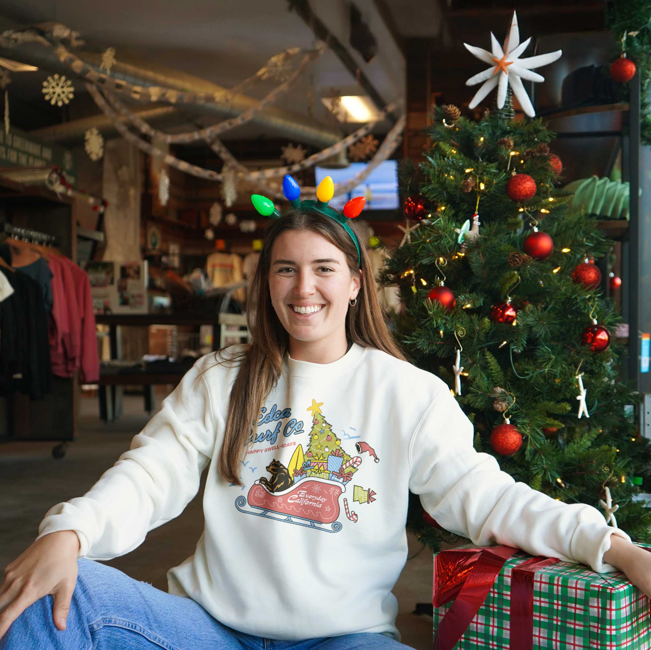 Female model wearing Everyday California Christmas crewneck