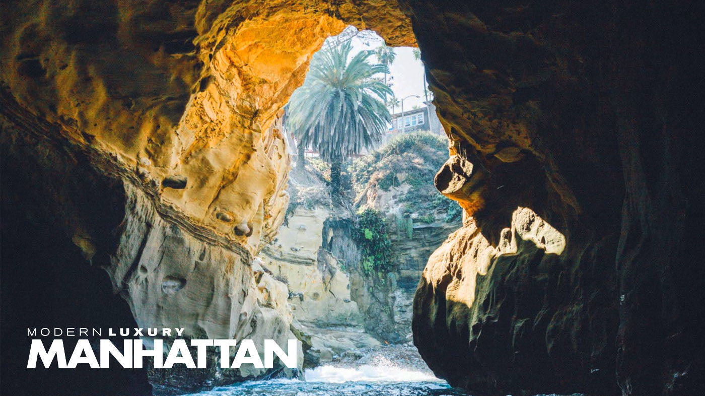 First person point of view photo from inside an ocean sea cave in La Jolla. The photographer is on a kayak