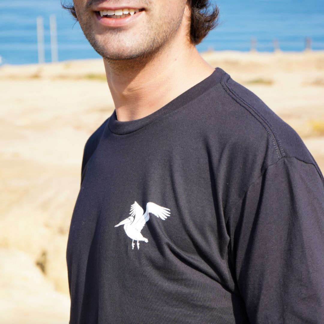A California man smiling with the waterbird tee 