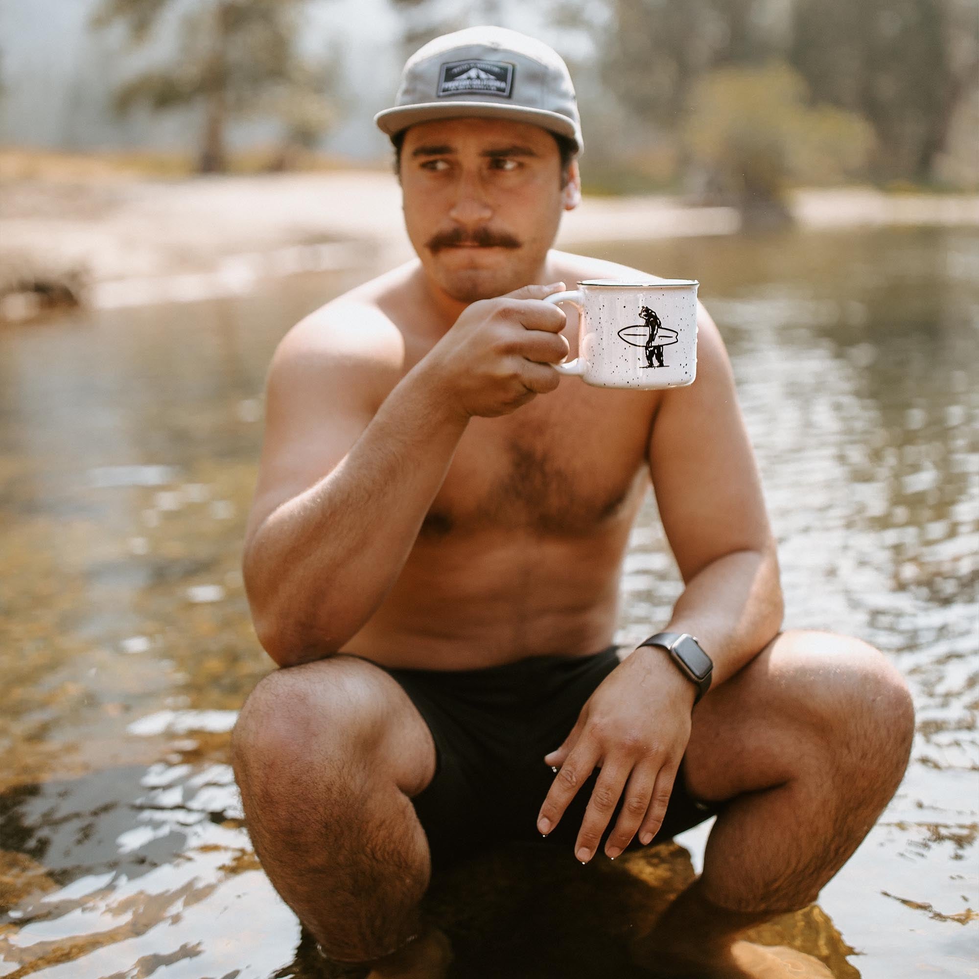 Everyday California Campfire Mug -  High-quality ceramic, speckled off-white mug with Everyday California Camping Logo on one side and Brutus the Bear on the other side. 